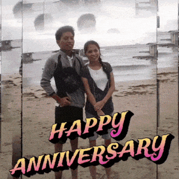 a couple standing on a beach with the words happy anniversary