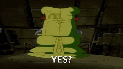 a cartoon character is sitting in a chair with the words `` yes '' .