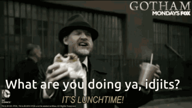 a man in a hat is holding a sandwich and a drink and says what are you doing ya