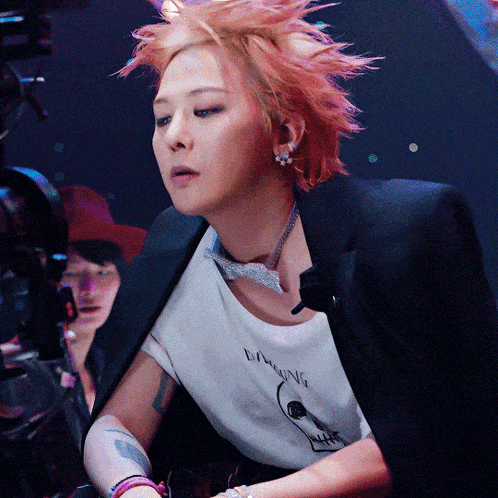 a woman with red hair is wearing a t-shirt that says laughing on it