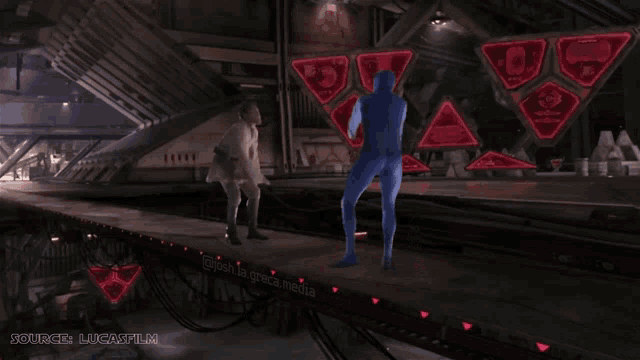 a man in a blue suit is standing in a room with the words source lucafilm on the bottom right