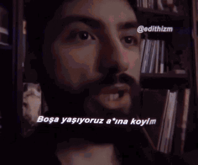 a close up of a man 's face with the words " sa yaşiyoruz a * ina koy "