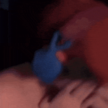 a blurry picture of a man wearing a red hat