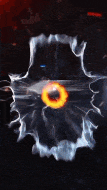 a fireball is surrounded by smoke in the dark