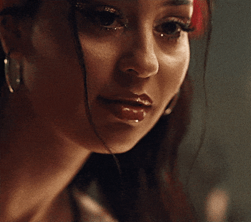 a close up of a woman 's face with a smile