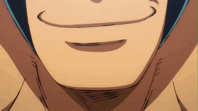 a close up of a man 's mouth with a smile