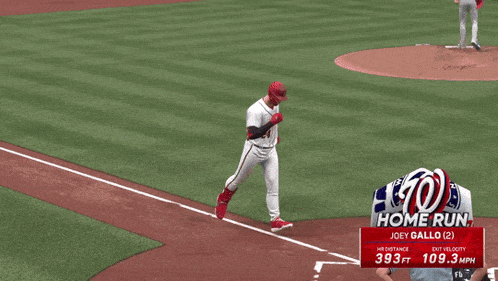 washington nationals player joey gallo high fives another player on the field