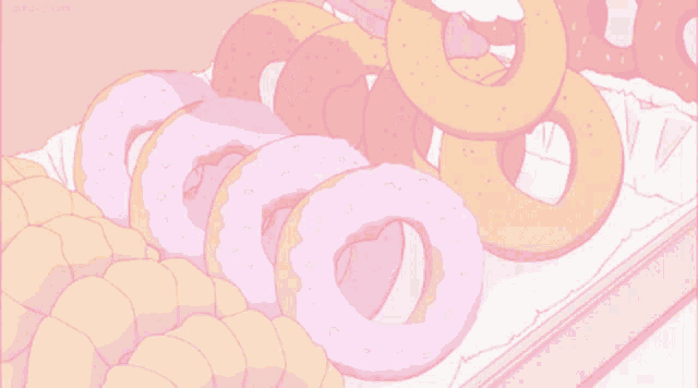 a bunch of donuts are on a table in a pink background