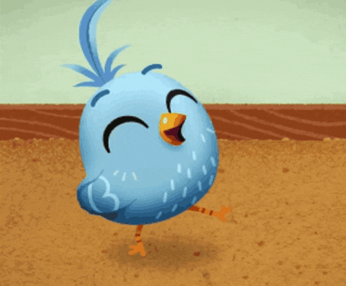 a blue bird with a yellow beak is standing on one leg