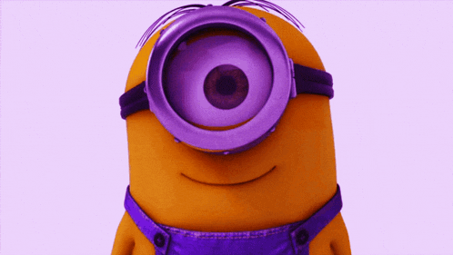 a yellow minion wearing purple overalls and goggles