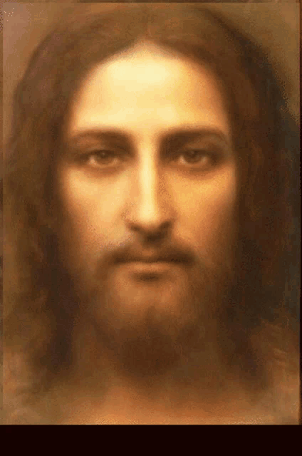 a close up of a man 's face with long hair