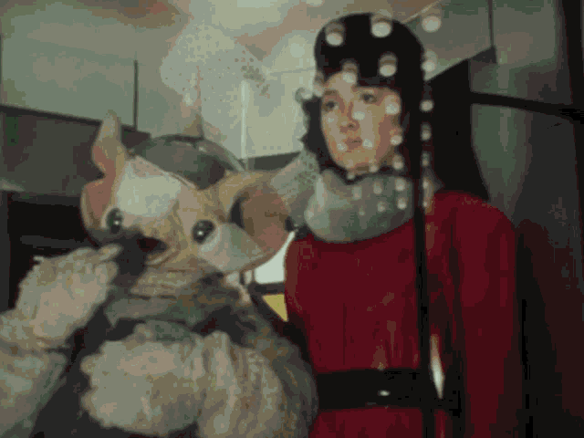 a woman in a red dress holds a stuffed animal