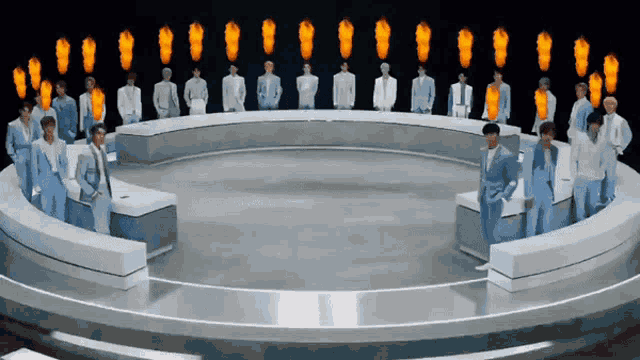 a group of men in suits are standing in a circle with flames coming out of their heads .