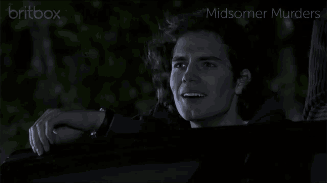a man in a car with the words midsomer murders above him