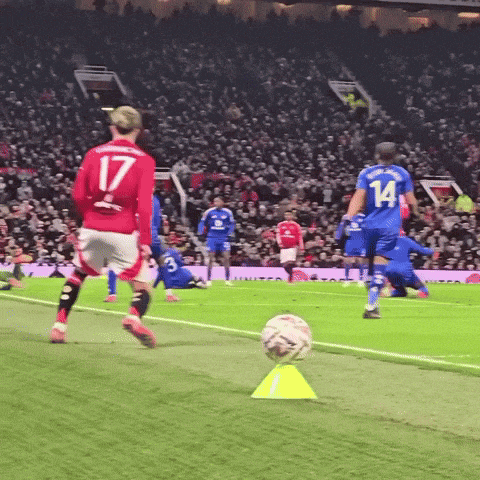 a soccer player in a red jersey with the number 17 on the back