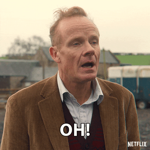 a man in a brown suit says " oh " in a netflix ad