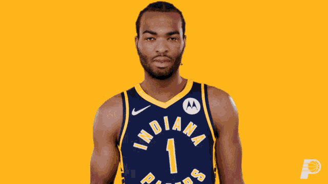a man in a indiana pacers jersey points at something