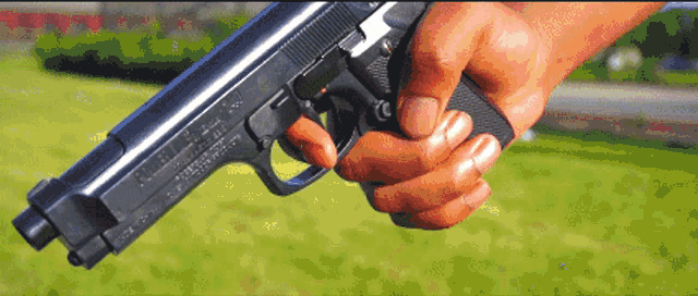 a person is holding a gun with the word smith & wesson on the side