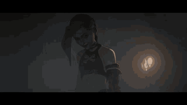 a woman with blue hair is standing in a dark room with a light behind her