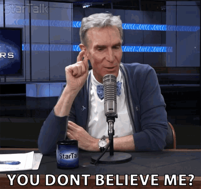 a man sitting in front of a microphone with the words you dont believe me