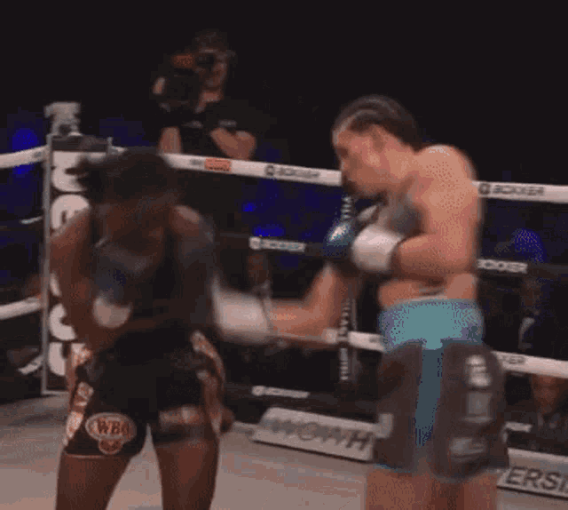 a boxing match with a bet365 sign in the corner