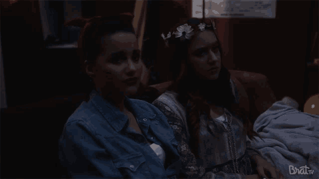 two women sitting on a couch with brat tv written on the bottom right