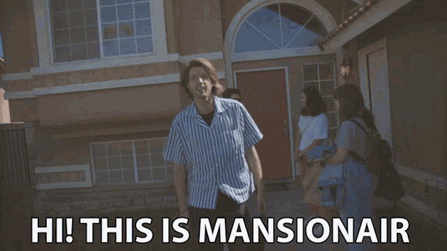 a man standing in front of a house with the words hi this is mansionair on the bottom