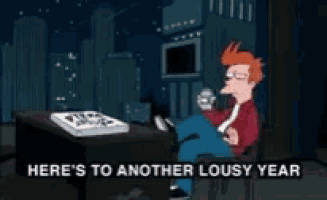 a cartoon character sitting at a desk with the words here 's to another lousy year