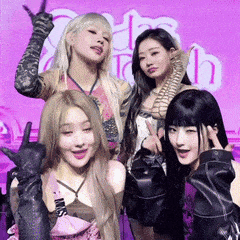a group of young women are posing for a picture .