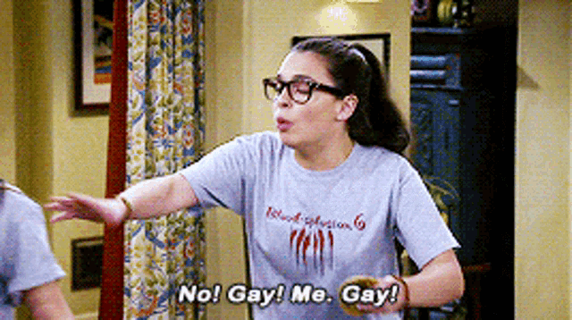 a woman in a t-shirt that says no gay me gay