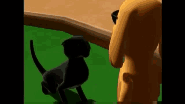 a black cat and a yellow dog are standing next to each other on a green field .