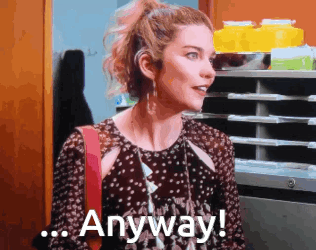 a woman in a polka dot dress is saying " anyway "