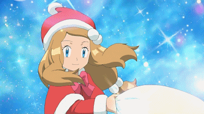 a girl in a santa hat is holding a cat in her hands