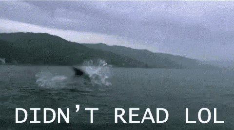 a shark is swimming in a body of water with the words didn 't read lol written on the bottom .