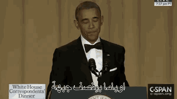 a man in a tuxedo is giving a speech at the white house