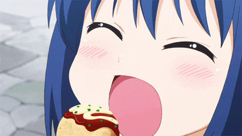 a girl with blue hair is eating a taco