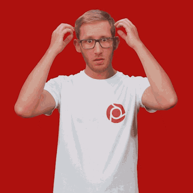 a man wearing glasses and a white shirt with the letter p on the front