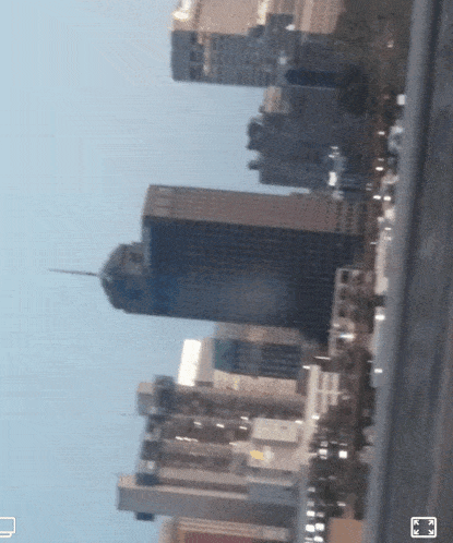 a blurry picture of a city skyline with a few buildings visible