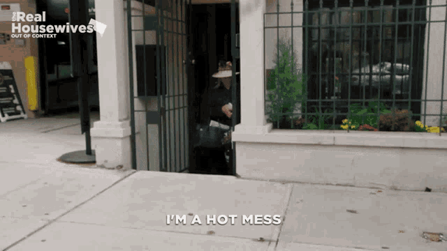 a real housewives advertisement shows a woman standing on the sidewalk