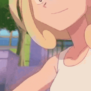 a close up of a cartoon girl with blonde hair .