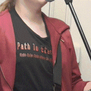a woman wearing a black shirt that says path to tter