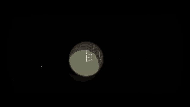 a green circle with a white triangle inside of it is floating in the dark .