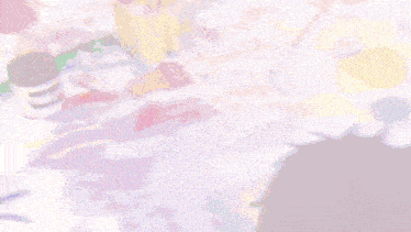 a blurred image of a person with a purple haircut