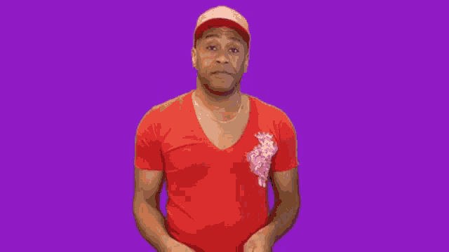 a man wearing a red shirt and a red hat