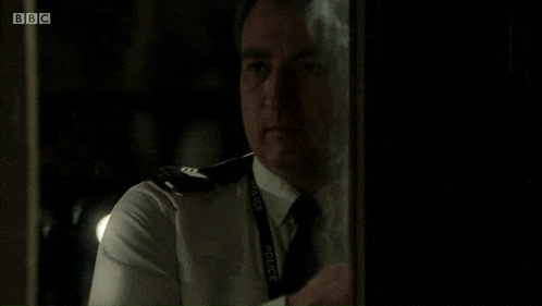 a blurry picture of a man with bbc written on the bottom left