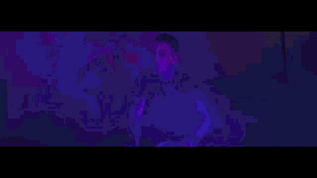 a man and a woman are dancing in the dark