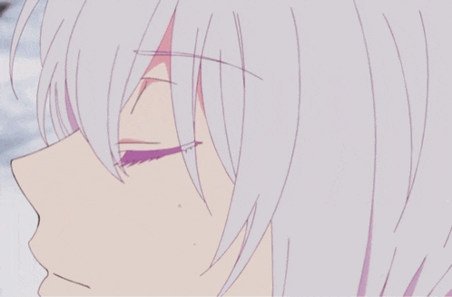 a close up of a person 's face with white hair