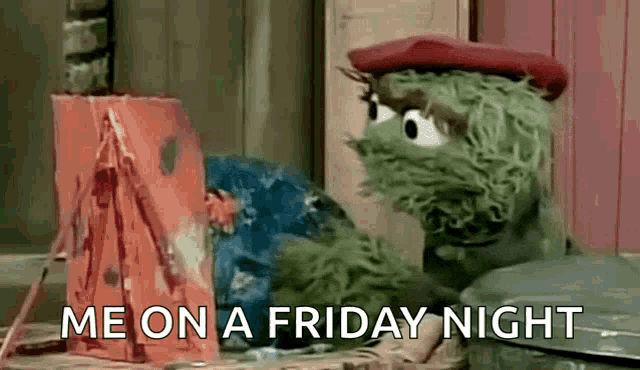 oscar the grouch from sesame street is sitting next to a trash can .