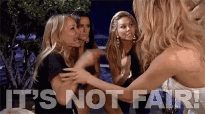 a group of women are sitting next to each other with the words `` it 's not fair '' written in the background .