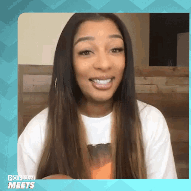 a woman is smiling in a pop buzz meets advertisement